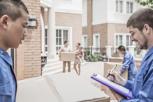 Experienced movers from Manwithvan Wimbledon handling furniture