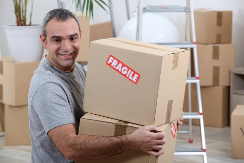 Experienced movers handling office equipment